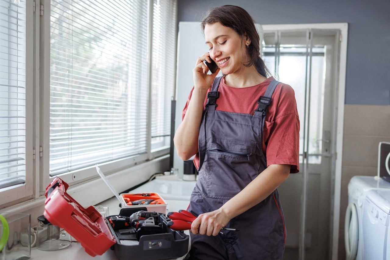 handywoman talking on the phone