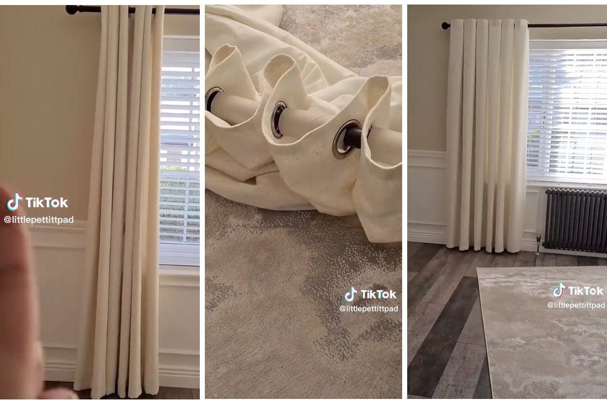 White curtains hang in a bright room, partially covering a window, while a rolled-up curtain fabric lies on a patterned rug next to a radiat